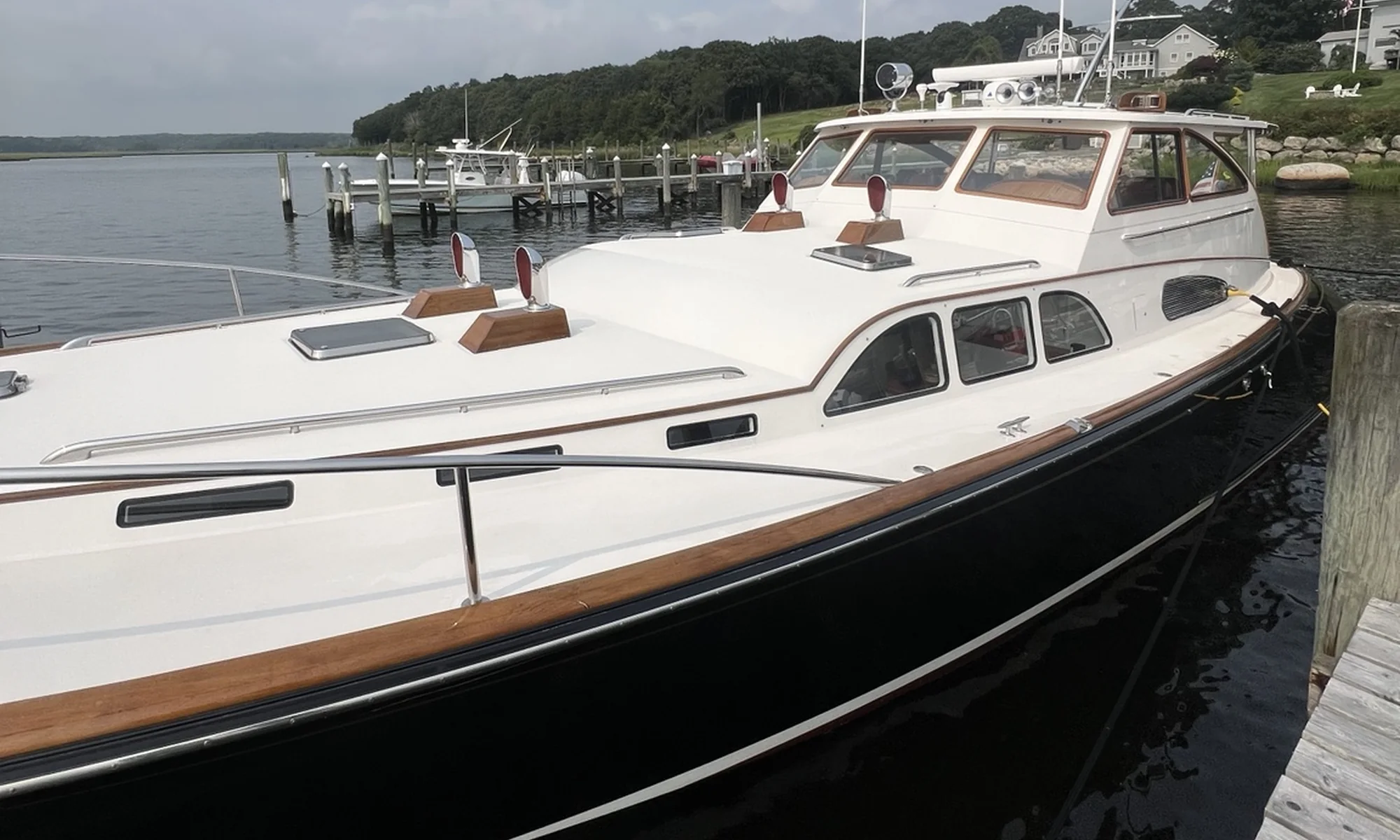 Classic dark-hulled yacht after detailing