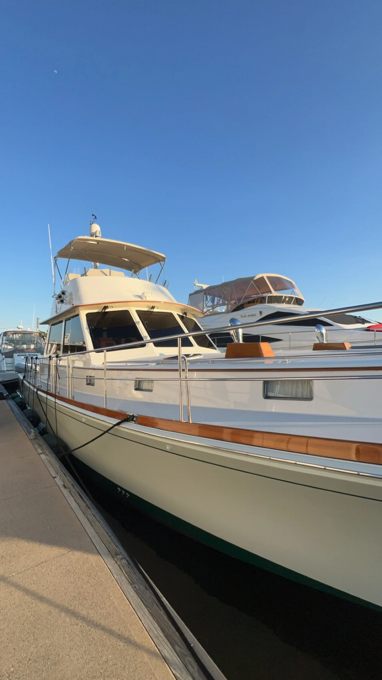 Classic cruising yacht with brightwork and white topsides