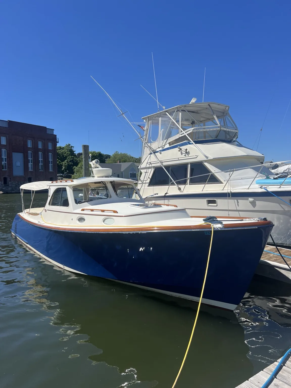 Blue Downeast-style boat at the dock