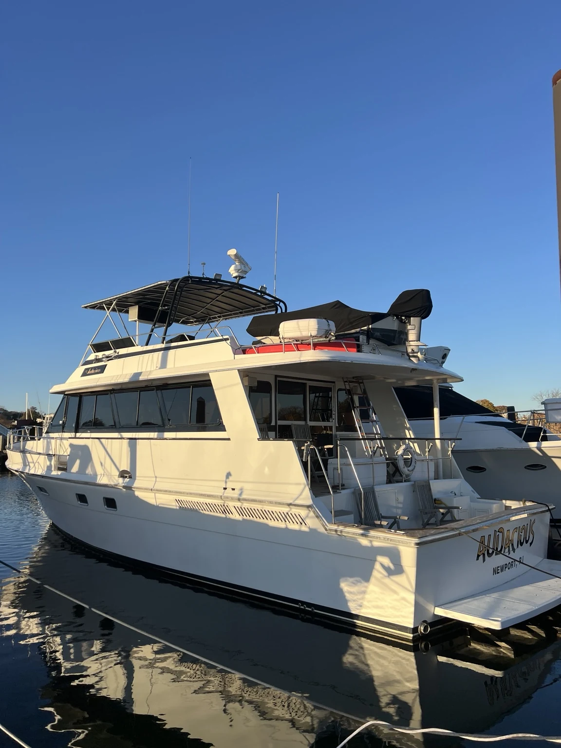 Large cruising motor yacht viewed from the aft quarter