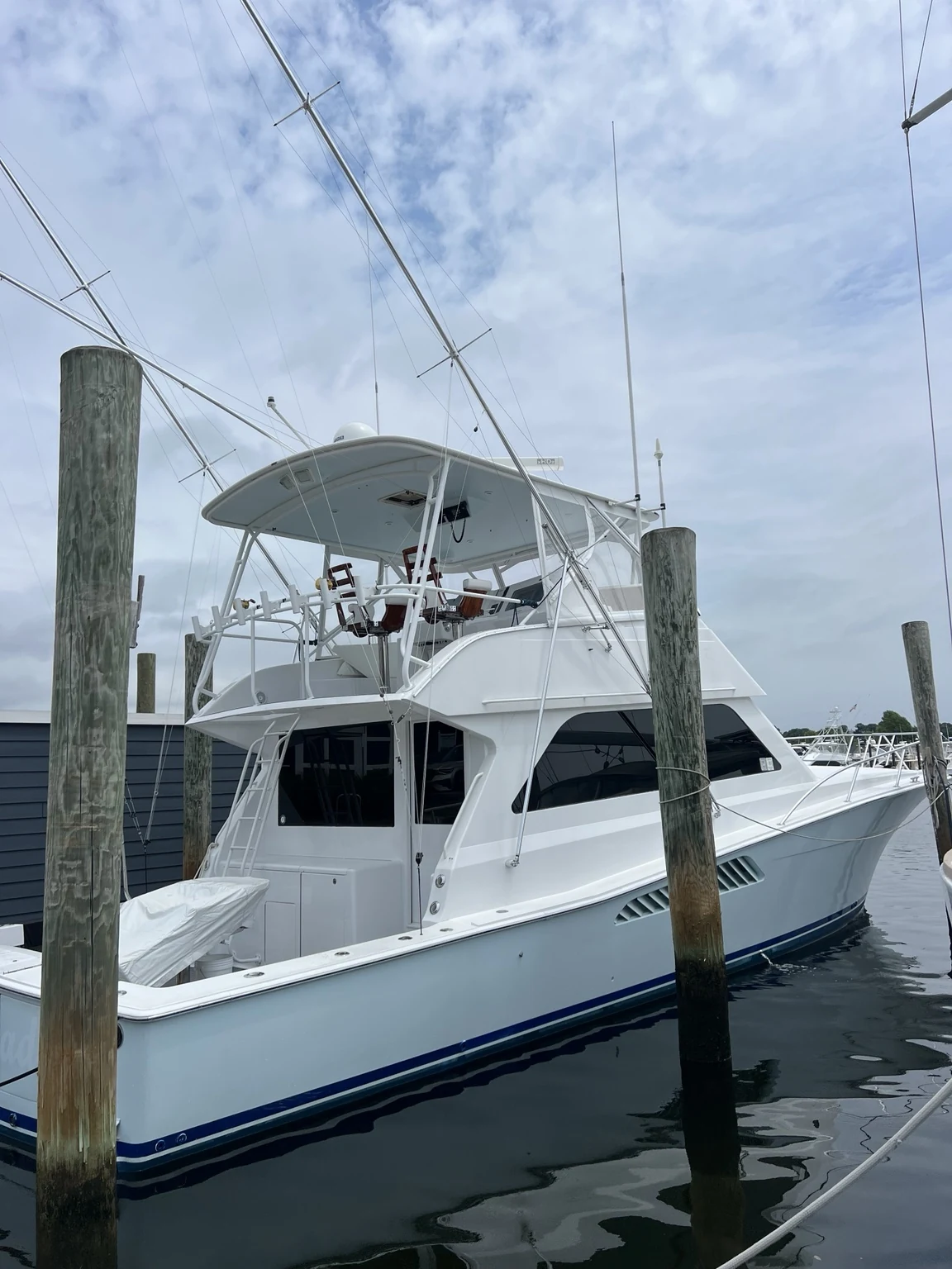Light-blue Viking sportfishing yacht at the marina