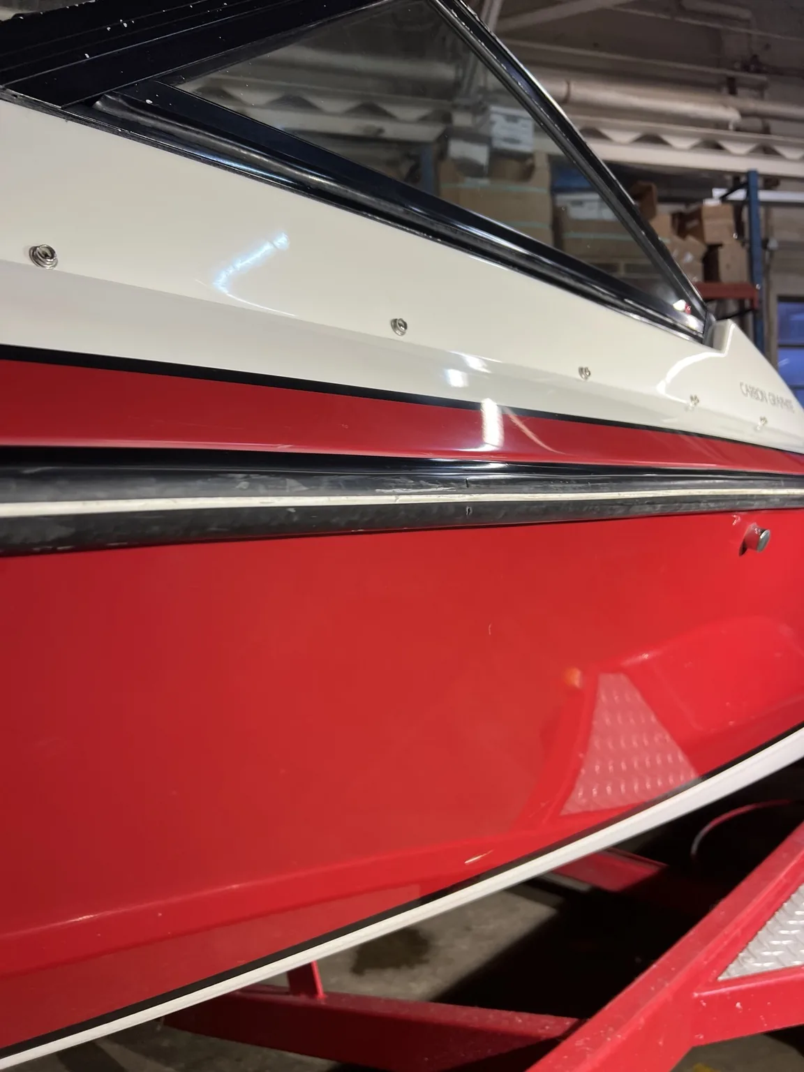 Gloss restored to a red runabout hull
