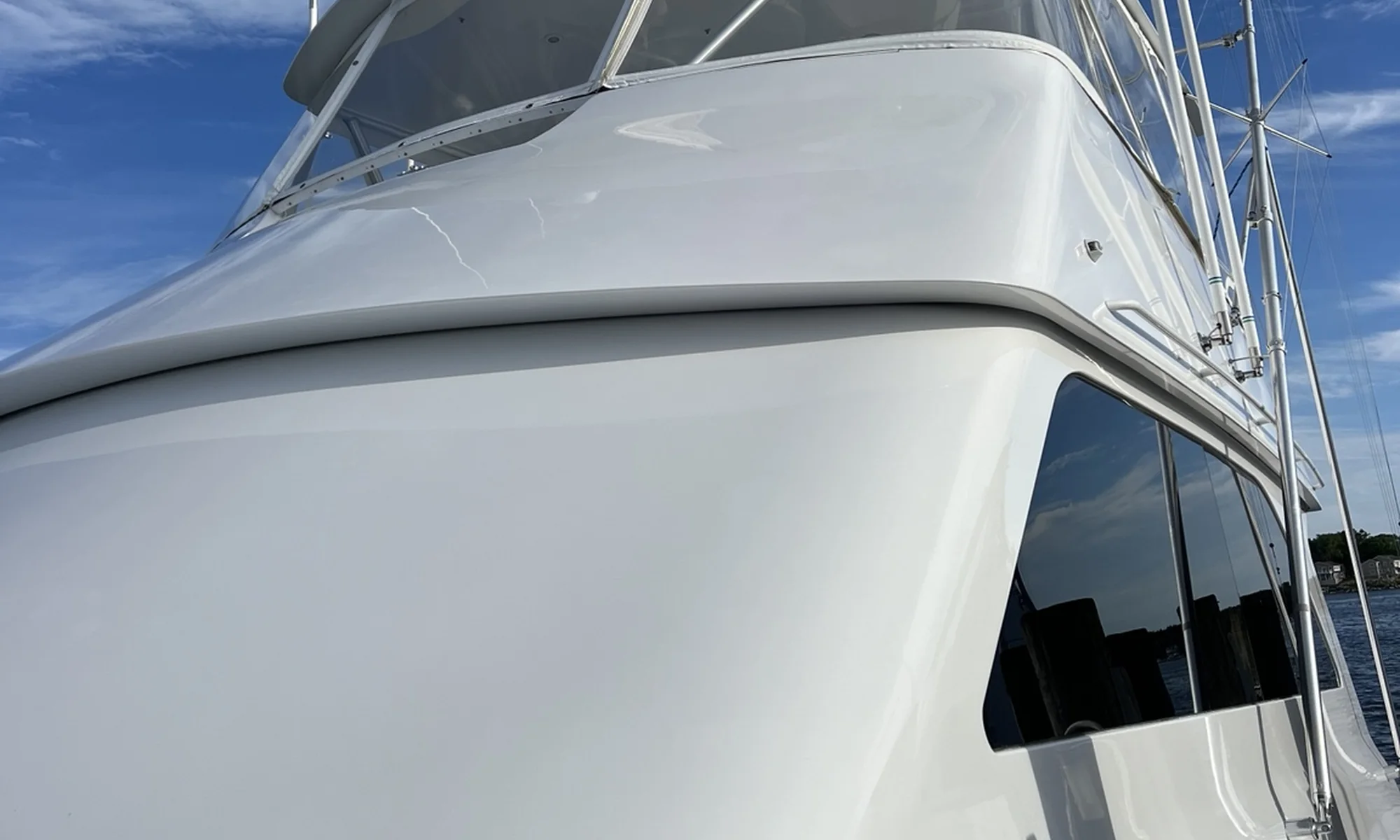 Polished white sportfishing yacht superstructure